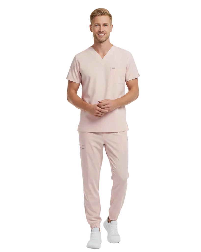 Pink scrub set with top and pants on a white background
