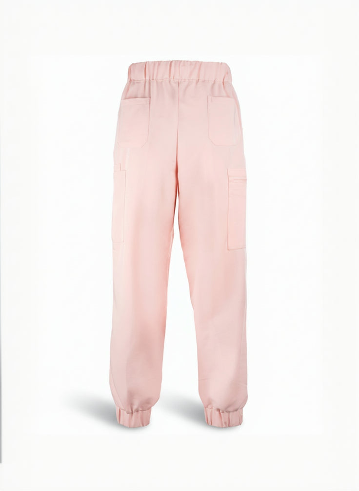 Pink scrub pants on a white background