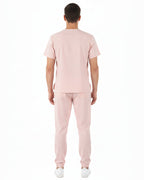 Light pink Jogger Scrub set on a white background
