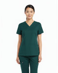 Person wearing a green scrub set on a white background