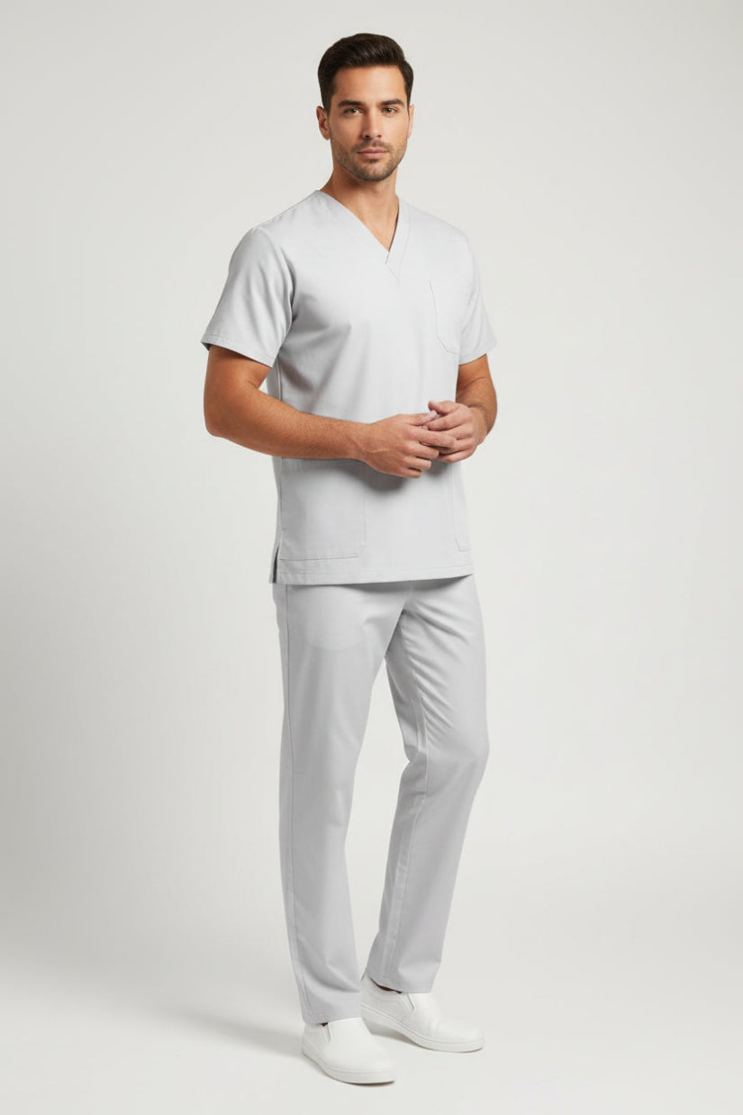 Gray scrub set with top and pants on a white background