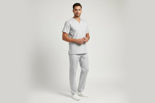Gray scrub set with top and pants on a white background