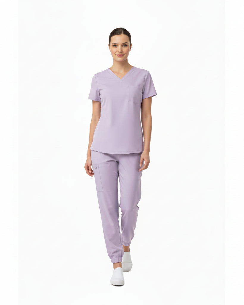 Lavender scrub set with top and pants on a white background