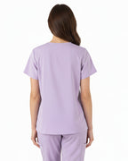 Lavender scrub set with top and pants on a white background
