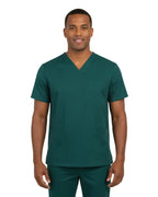 Man wearing a green scrub set on a white background