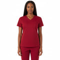 Female model in Heartbeat Crimson jogger scrub pants, front 