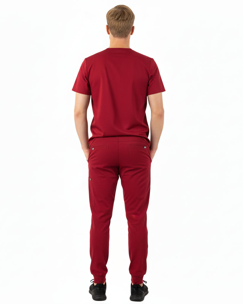 Back view of male model in Heartbeat Crimson jogger scrub