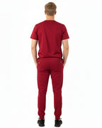 Back view of male model in Heartbeat Crimson jogger scrub