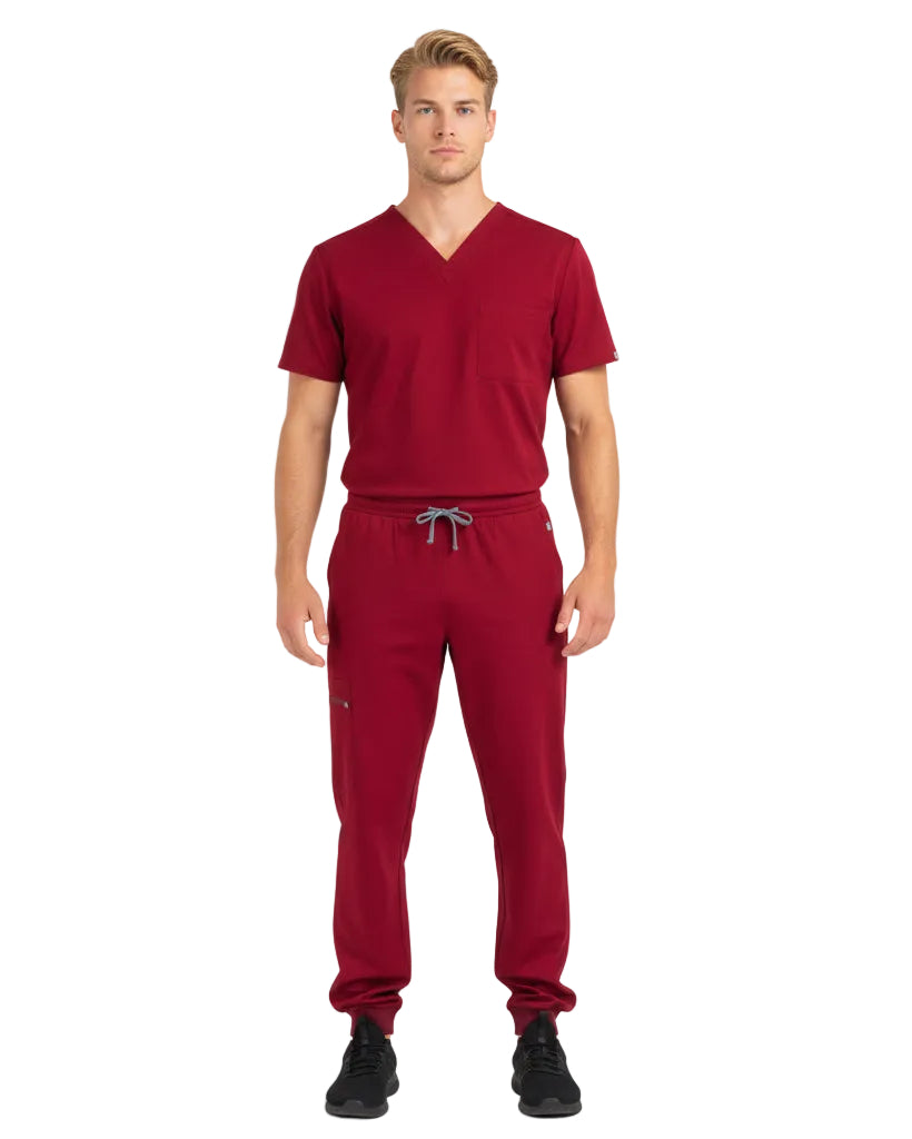 Male model wearing Heartbeat Crimson jogger scrub pants, front view

