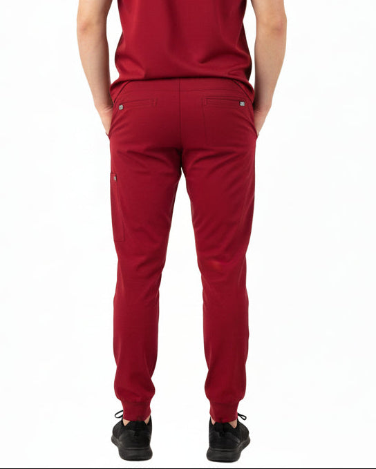 Back view of male model in Heartbeat Crimson jogger scrub bottoms